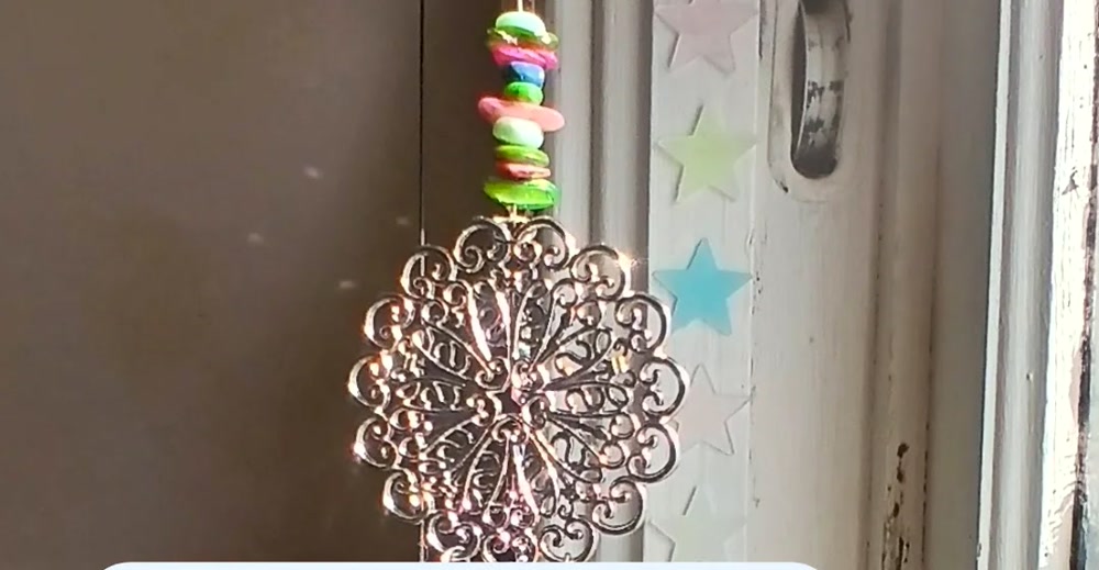 One of Kristen's handmade crystal suncatchers catching the light